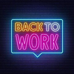 Back to Work neon lettering on brick wall background.