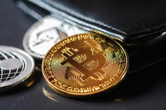 Maesot, Thailand- June 5, 2021:Close-up of a cryptocurrency coin with wallet, New concept crypto currency virtual money is the future of digital currency online financial payments.
