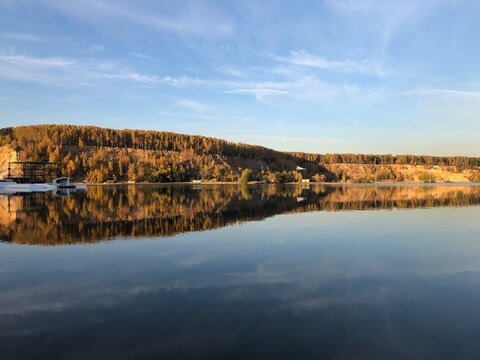 autumn forest on Dzerzhinsky lake, sunny evening