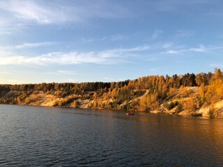 autumn forest on Dzerzhinsky lake, sunny evening