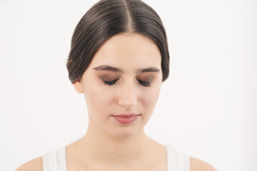 Young girl crying in the frame. Face close up. Spoiled makeup through tears.