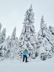 smiling woman skier at powder day