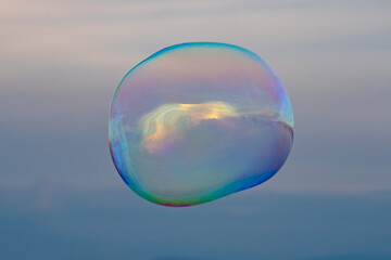 Large Shiny Colourful Bubble Floating in Air