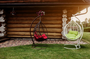 Two rattan hanging chairs