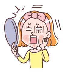 鏡を見て肌荒れにショックを受ける女性