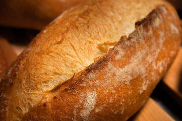 Craft loaves of bread. Fresh hot bread from the oven. Appetizing and healthy food