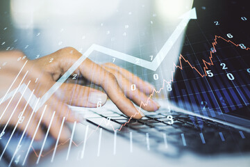 Abstract creative financial graph with upward arrow and hands typing on laptop on background, financial and trading concept. Multiexposure