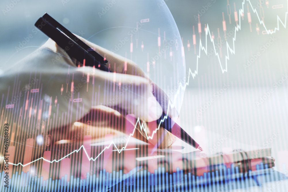 Aufkleber abstract creative financial graph with world map and with woman hand writing in notebook on backgrou