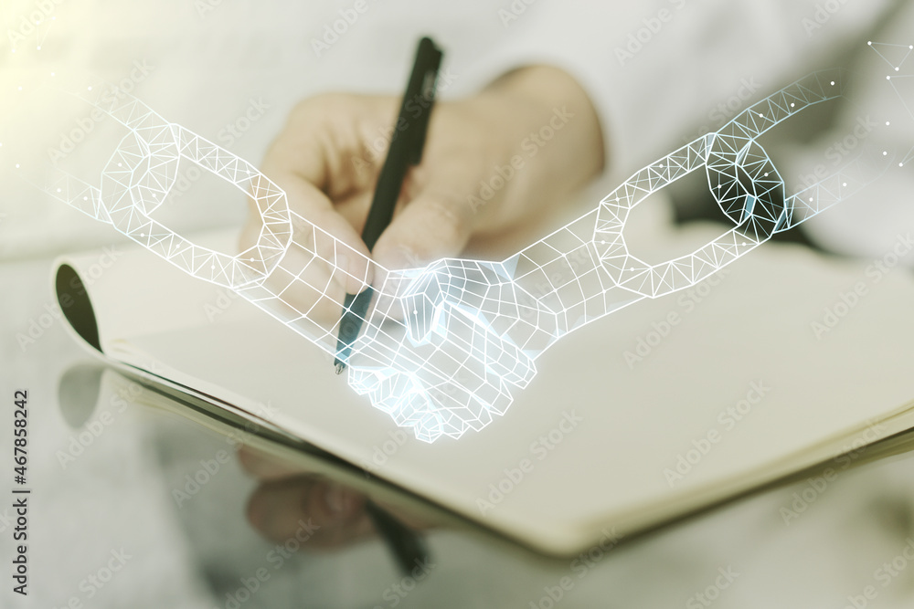 Poster creative concept of blockchain technology with handshake and man hand writing in notebook on backgro