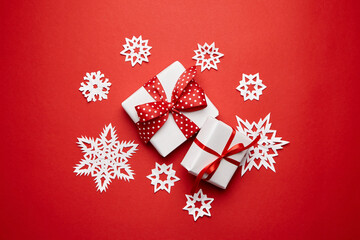 Christmas gift boxes with white snowflakes on red