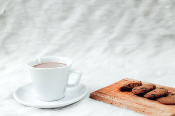 Hot chocolate drink and cookies for winter season background 