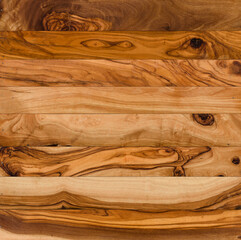 Olive wood background. Olive tree planks cobbled together, top view.