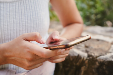 Close-up of a person's hands using mobile