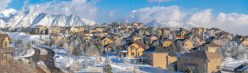 Snowy residential area at Draper in Utah with a view of Wasatch Mountains at the background