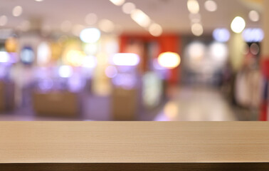 Empty wooden table in front of abstract blurred background of coffee shop . can be used for display or montage your products.Mock up for display of product