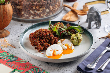 Portion of appetizing quinoa salad with eggs and avocado