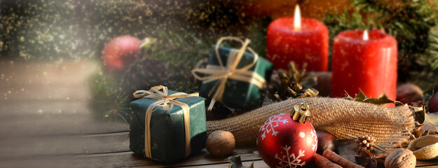 traditional christmas decoration on a wooden table in golden confetti