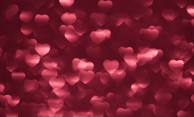 Background bokeh in the form of hearts of red and pink color. Copy space for text. The concept of romance and love. Valentine's Day. Shiny texture background. Festive background.
