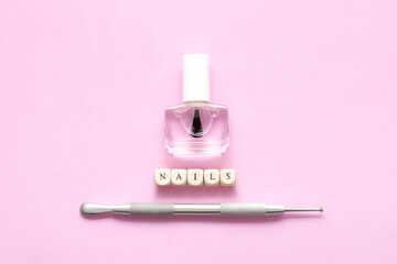 Top view on manicure equipment set. Female nails care equipment. Manicure and pedicure equipment on pink background. Copy space. - obrazy, fototapety, plakaty