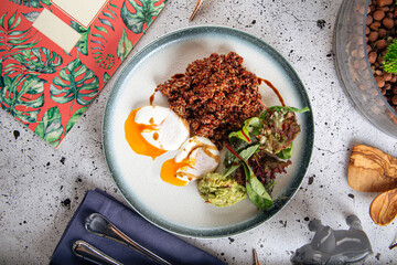 Portion of appetizing quinoa salad with eggs and avocado
