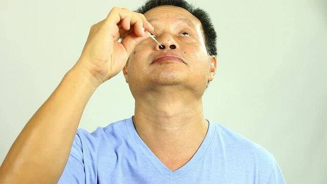 Man is using coronavirus(covid-19) rapid antigen self test kit, in studio Chiangmai  Thailand.