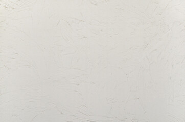 Trowel plastering wall texture background. Decorative plaster stucco effect on wall.