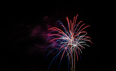 Beautiful shot of a colorful firework in the dark sky with copy space - perfect for backgrounds