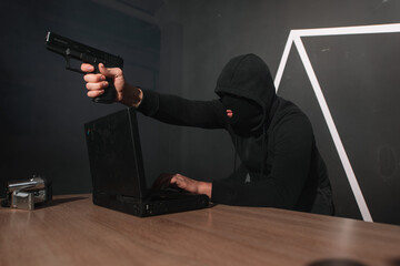 hacker with gun