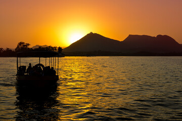 sunset on the lake udaipur boat sunset view  