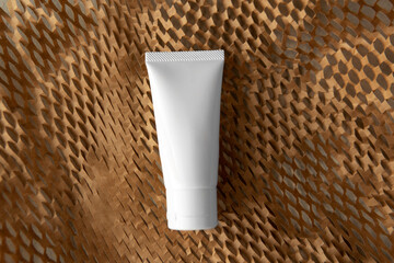 Mockup facial skincare white tube blank bottle natural product on Honeycomb Environmental friendly...