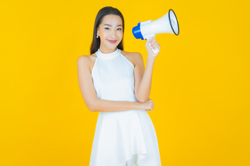 Portrait beautiful young asian woman smile with megaphone
