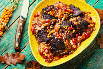 Tasty veal meat grilled with berries.