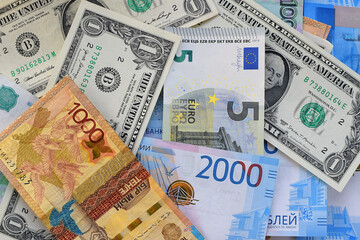 Fototapeta na wymiar Banknotes of different countries. Currency exchange concept. International trade. Money background. Selective focus. Flat lay.