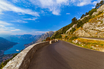 Fototapeta na wymiar Mountains road and Kotor Bay on sunset - Montenegro
