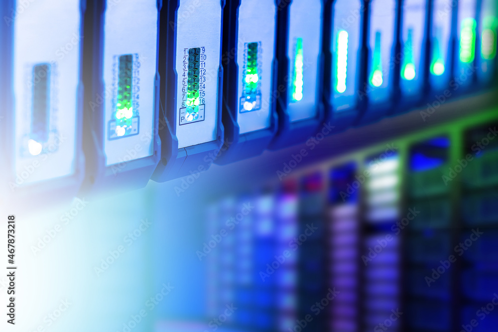 Poster server background. fragment of server equipment close-up. server racks with neon glow. cyber ​​infra