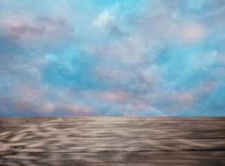 Empty table top for product presentation against sky background