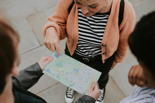Travelers reading map