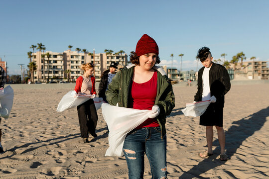 Teen eco activists, volunteering to pick up trash