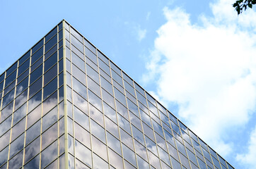 Fototapeta na wymiar glass facade of a new modern building in a modern city concept. Bottom view