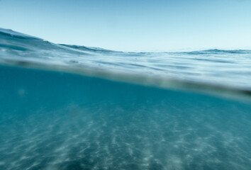 Fototapeta na wymiar Split View Half Over and Under Ocean Surface whit Clear Sky. Background Concept