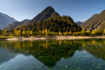 view of Lake Jasna with forest and mountain landscape in beautiful autumn colors