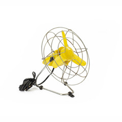 old fashioned yellow electric fan on white background