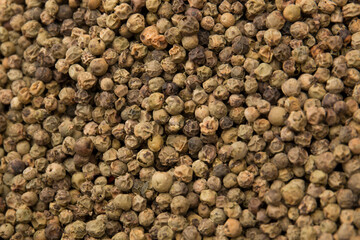 Black hot allspice. Peppercorns close-up.
