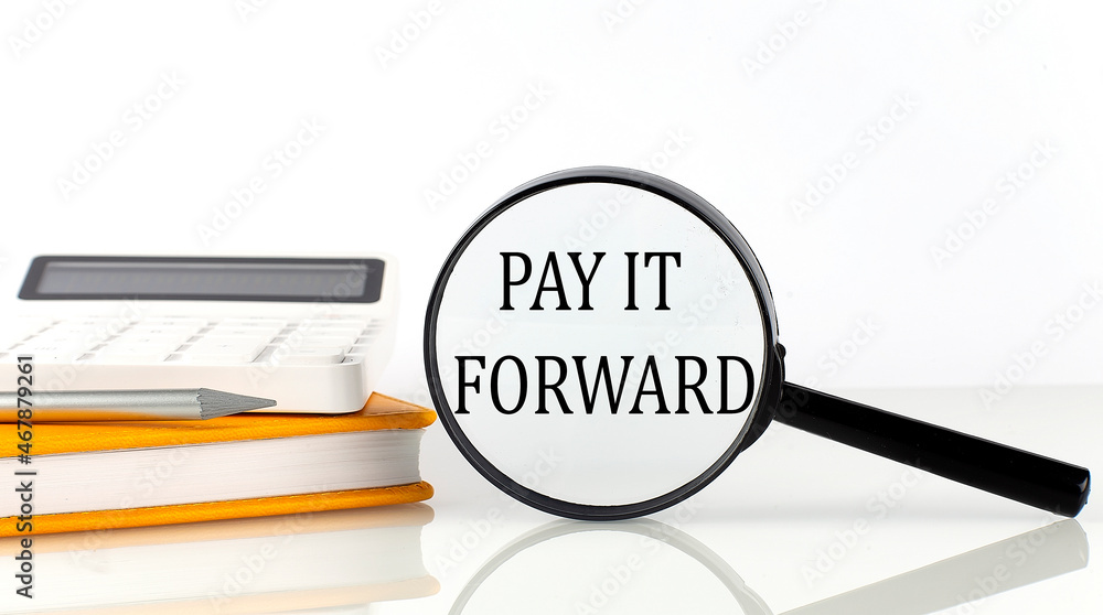 Poster magnifier with text pay it forward with notebook, calculator on white background