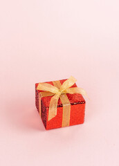 Red gift box with golden ribbon