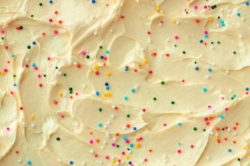 Cake frosting texture background vector with sprinkles on top