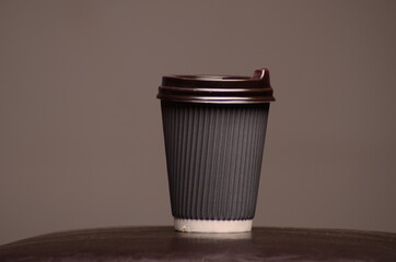 Paper coffee cup in coffee shop.