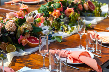 Table served for wedding dinner, close up view. decoration concept for citrus weddings party or social events Lemons and grapefruit