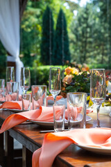 Table served for wedding dinner outdoor, close up view. decoration concept for citrus weddings party or social events. vertical photo