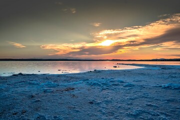 The Salinas of Torrevieja at sunset, a lagoon that produces salt by evaporation and is pink in color due to the microorganisms that inhabit it